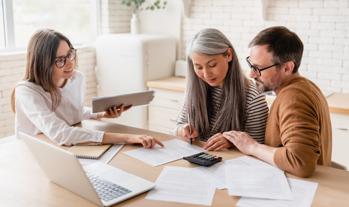 tax preparation expert with clients working on back taxes