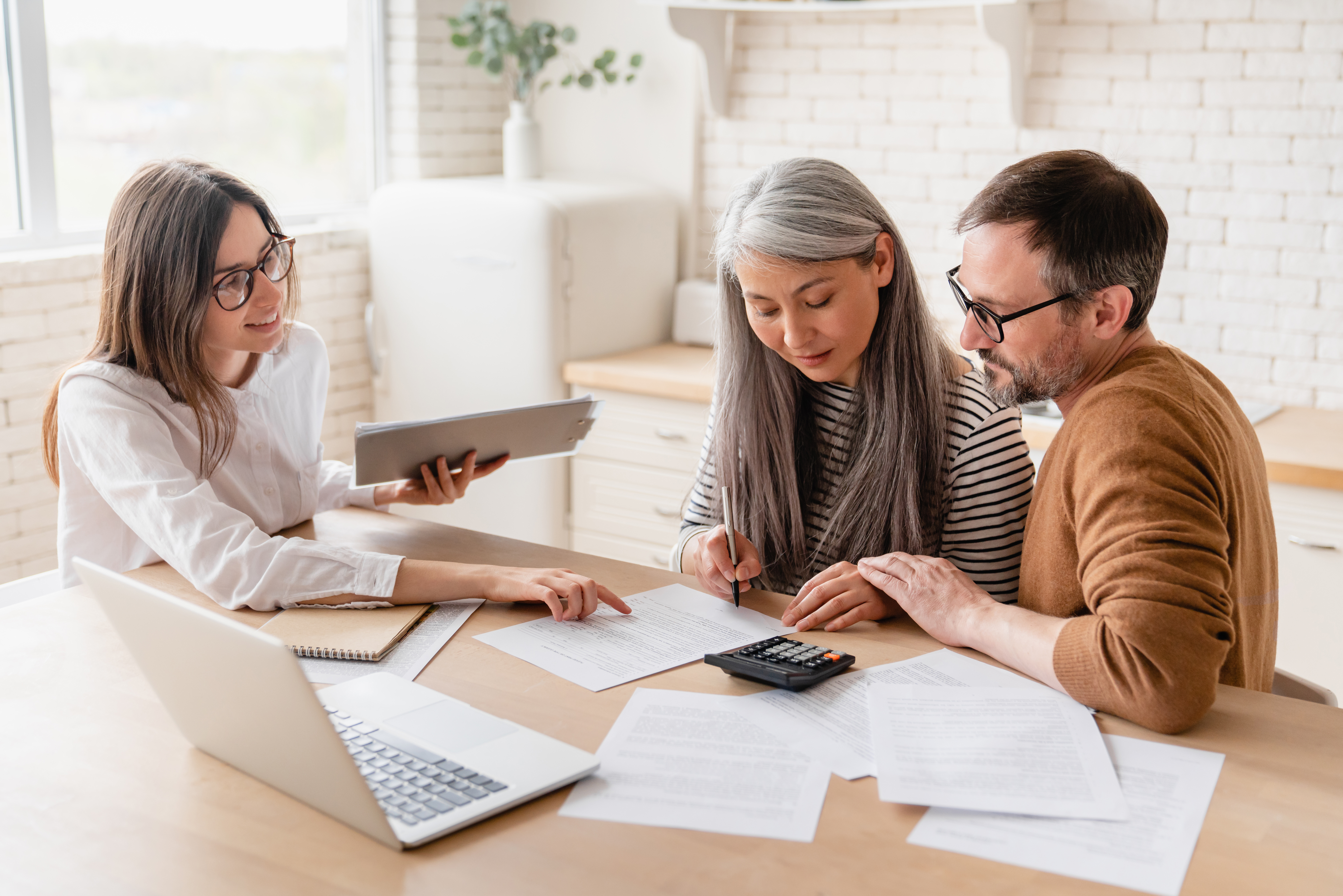 tax preparation expert with clients working on back taxes